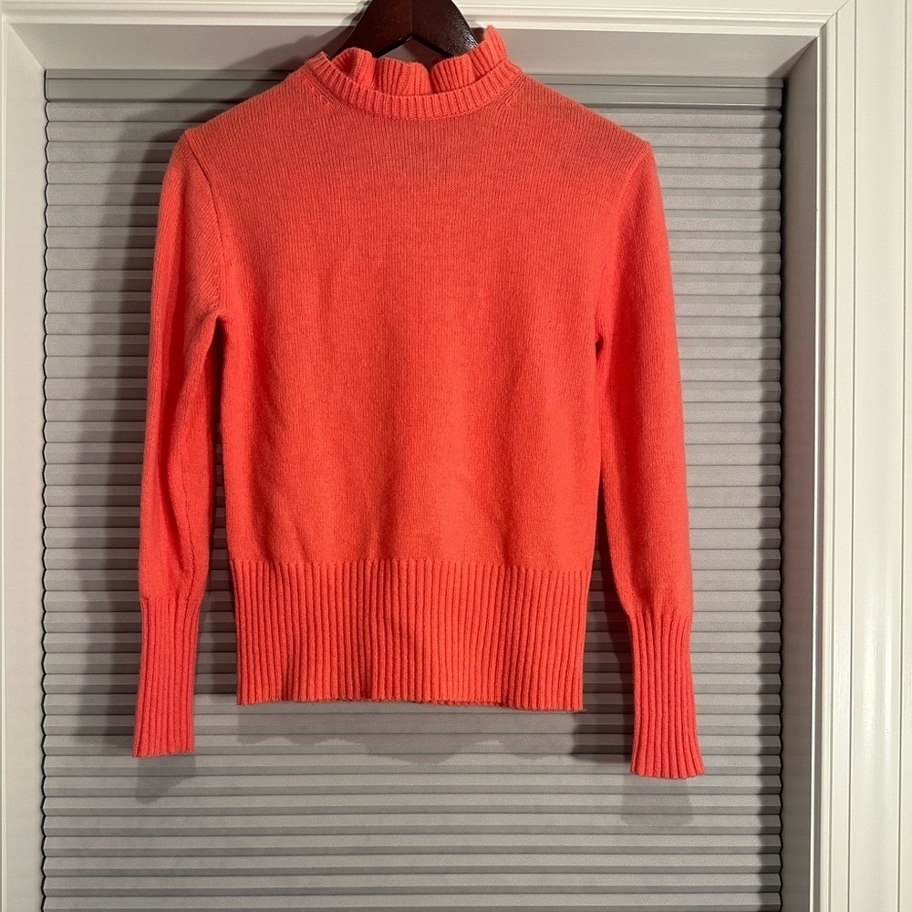 Coral pink wool blend sweater with ruffle neck from J. Crew